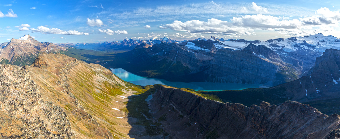 Panoramic view south from Bow Peak summit. Hector Lake below in foreground, Balfour glacier and Peak upper right. Louise group just left of center in the distance. Mt. Hector far left